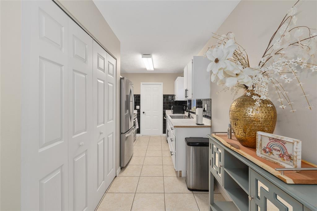 5255 Northwest 64 Street Ocala, FL 34482 - Photo 11 of 24 a kitchen with stainless steel appliances granite countertop a lot of counter space and cabinets