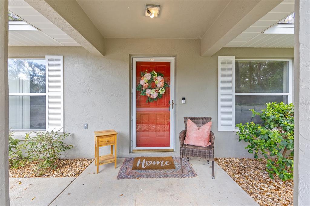 5255 Northwest 64 Street Ocala, FL 34482 - Photo 3 of 24 a front view of a house with garden