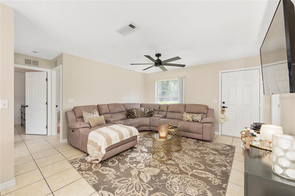 5255 Northwest 64 Street Ocala, FL 34482 - Photo 6 of 24 a living room with furniture and a rug