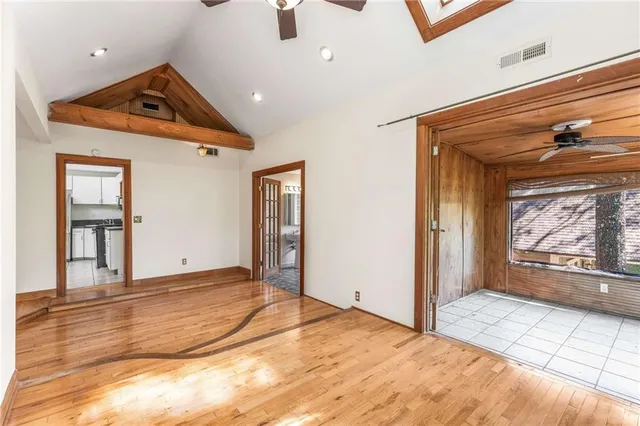 a kitchen with stainless steel appliances a stove top oven and a refrigerator