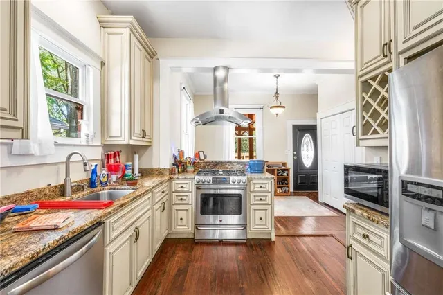 a view of a livingroom with furniture and wooden floor