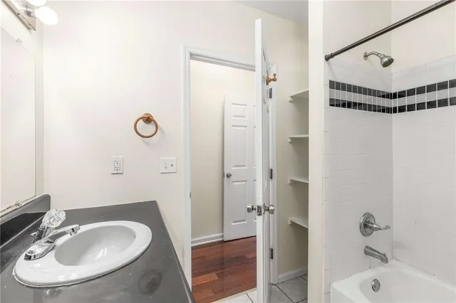 a kitchen with stainless steel appliances granite countertop a refrigerator and a stove