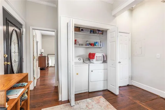 a bathroom with a granite countertop sink a mirror and shower