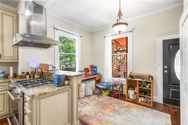 a view of a hallway with wooden floor windows and livingroom