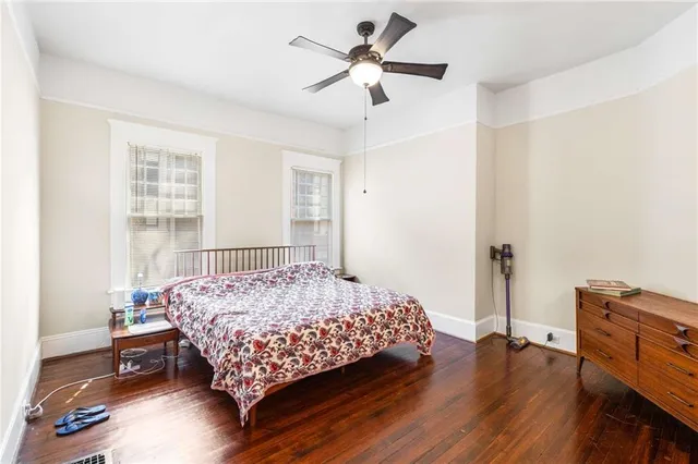 aerial view of a house with balcony and trees