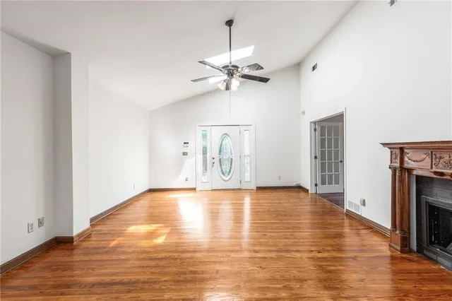 a kitchen with a stove a refrigerator and cabinets