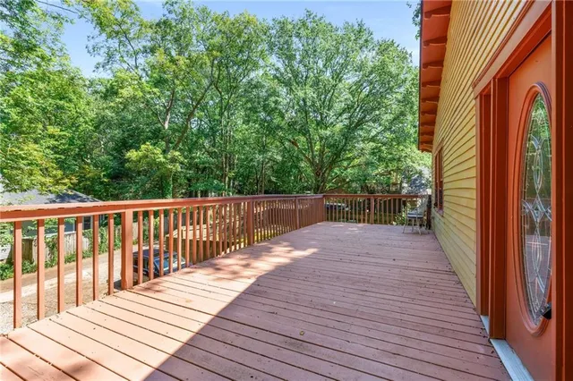 a living room with furniture dining table and a chandelier