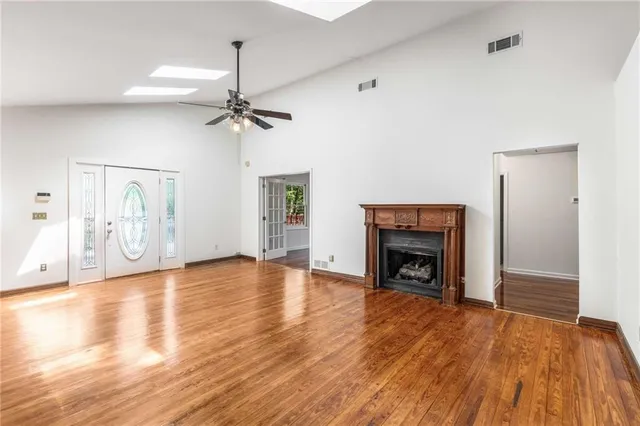 a kitchen with a stove a refrigerator and cabinets