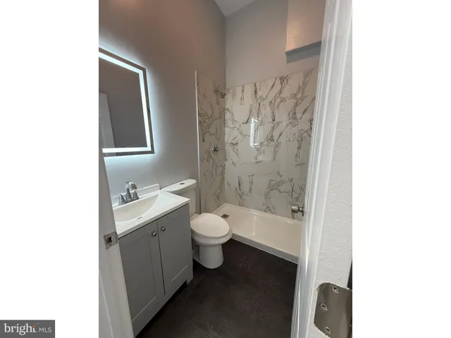 a bathroom with a toilet a sink and a bathtub