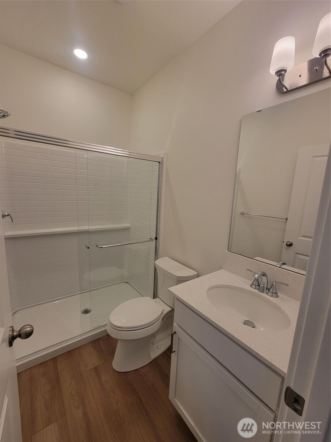 748 Holly Avenue, Unit 39 Buckley, WA 98321 - Photo 12 of 29 a bathroom with a toilet a sink and mirror