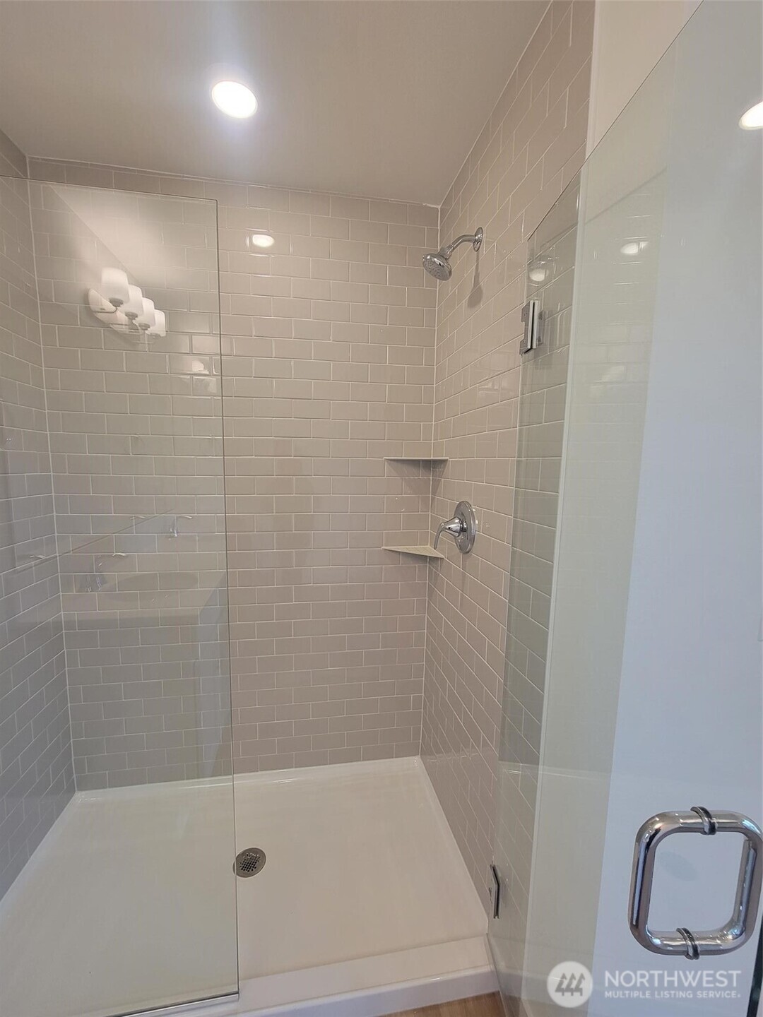 748 Holly Avenue, Unit 39 Buckley, WA 98321 - Photo 23 of 29 a bathroom with a shower a toilet and sink