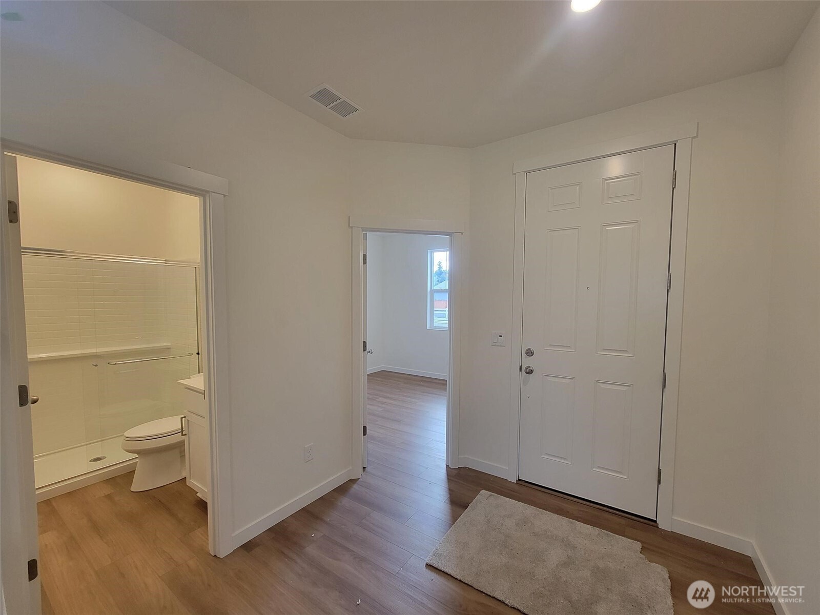 748 Holly Avenue, Unit 39 Buckley, WA 98321 - Photo 10 of 29 a view of room with wooden floor and bathroom view