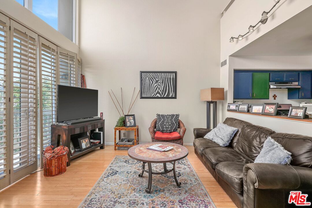 6690 Vista Del Mar, Unit E Playa del Rey, CA 90293 - Photo 3 of 12 a living room with furniture and a flat screen tv