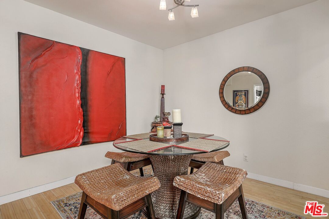 6690 Vista Del Mar, Unit E Playa del Rey, CA 90293 - Photo 6 of 12 a dining room with furniture and a window