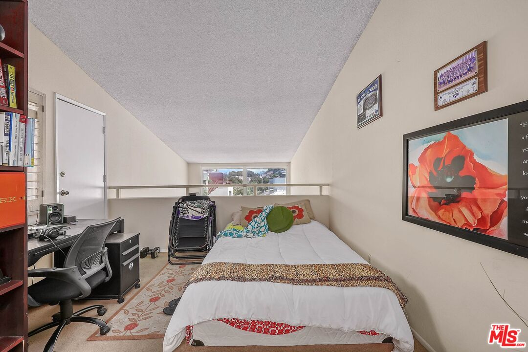 6690 Vista Del Mar, Unit E Playa del Rey, CA 90293 - Photo 9 of 12 a bed room with a bed