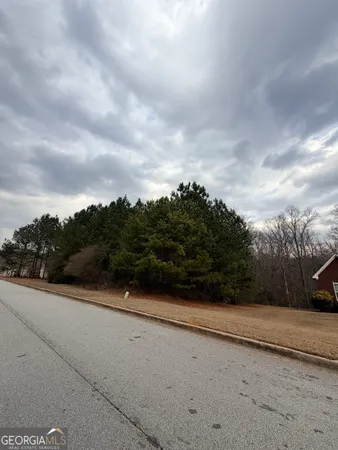 a view of city street with view of trees