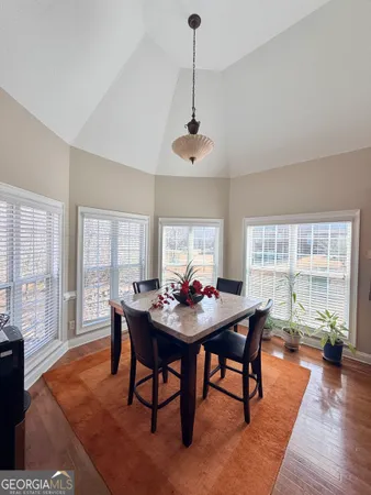 a view of a dining room with furniture window and wooden floor