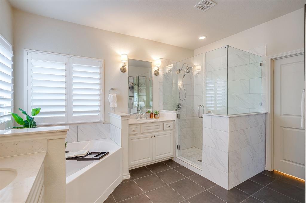 100 Grey Stone Street Aledo, TX 76008 - Photo 18 of 40 a bathroom with a double vanity sink a large mirror and a shower