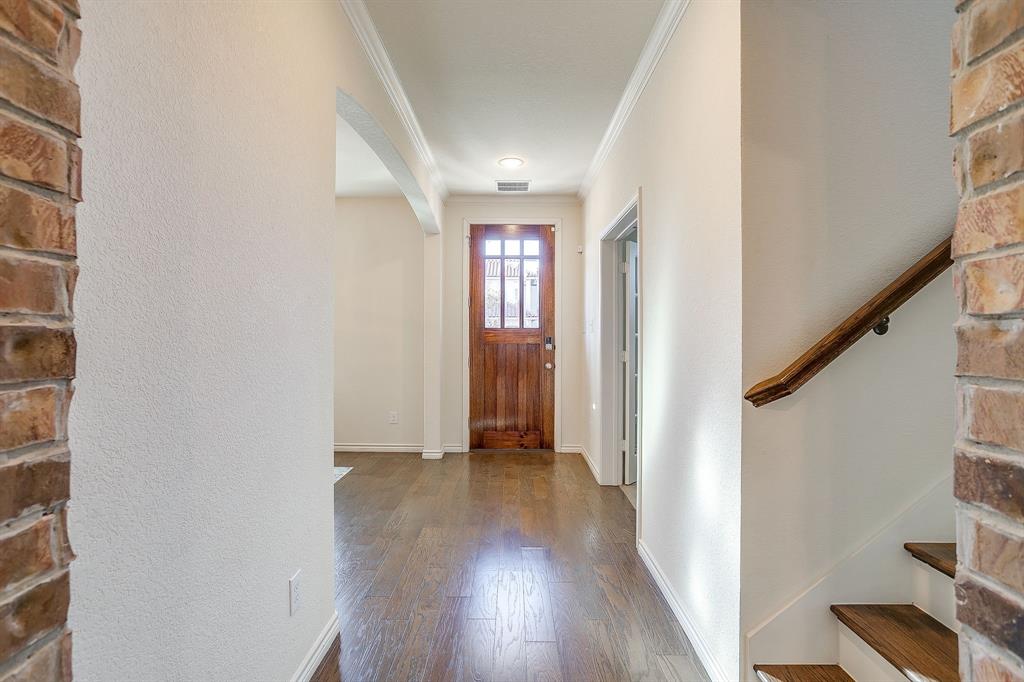 100 Grey Stone Street Aledo, TX 76008 - Photo 2 of 40 a view of a hallway with wooden floor and entryway