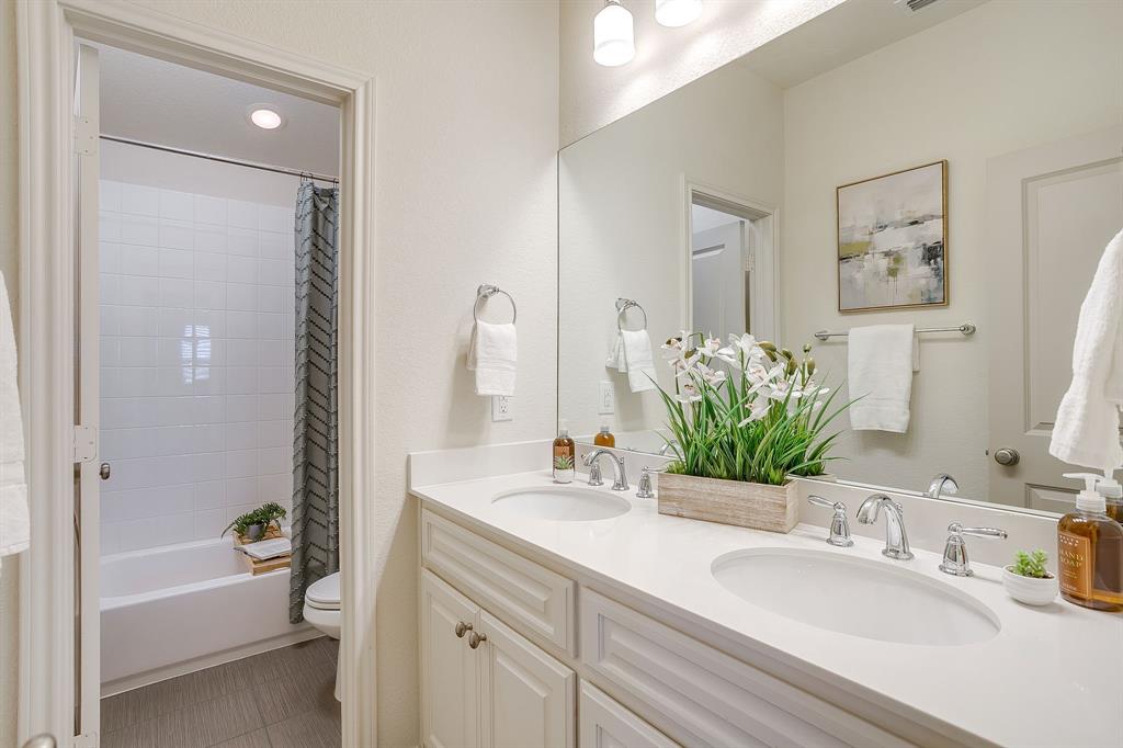 100 Grey Stone Street Aledo, TX 76008 - Photo 25 of 40 a bathroom with a granite countertop sink tub and a mirror