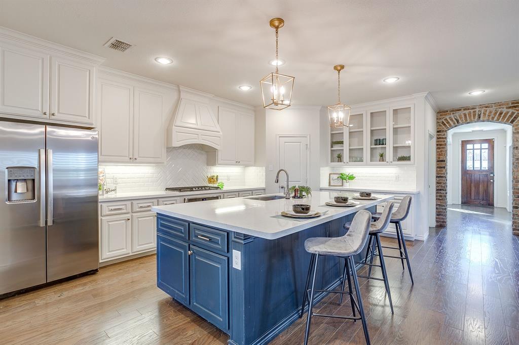 100 Grey Stone Street Aledo, TX 76008 - Photo 7 of 40 a kitchen with a center island appliances and cabinets