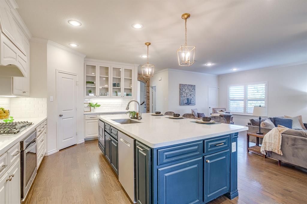 100 Grey Stone Street Aledo, TX 76008 - Photo 40 of 40 a large kitchen with kitchen island a sink a center island a stove and a center island