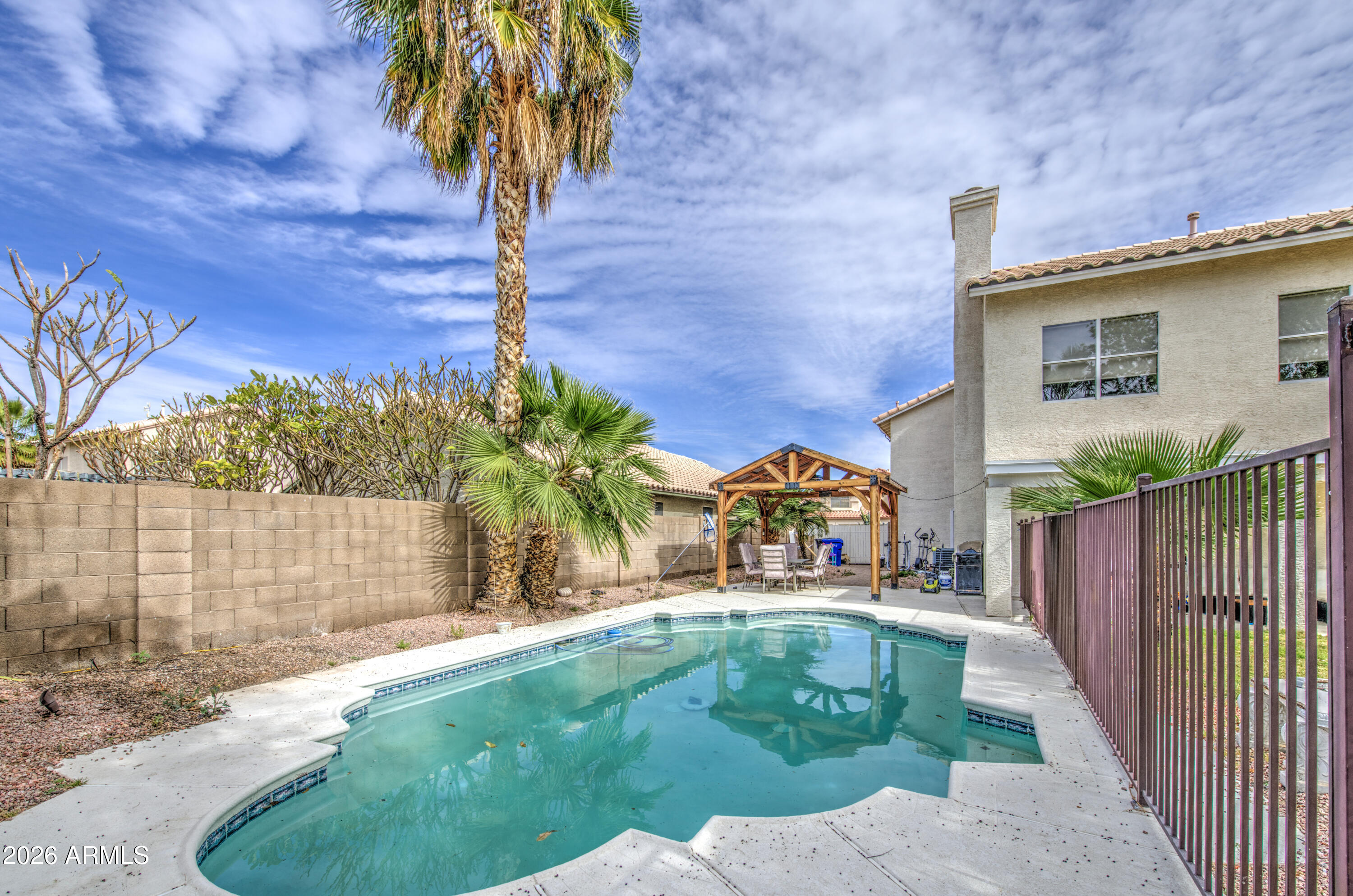 12403 West Monte Vista Road Avondale, AZ 85392 - Photo 51 of 63 a front view of a house with garden
