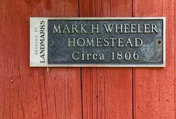 a sign on wooden wall