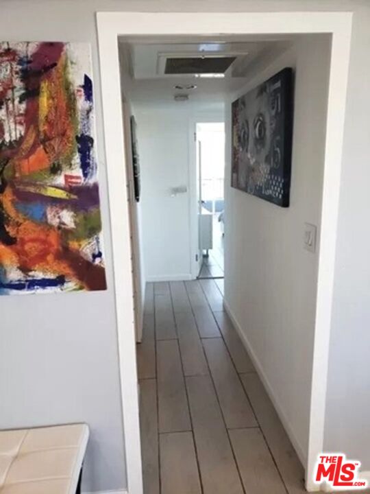 10501 Wilshire Boulevard, Unit 2103 Los Angeles, CA 90024 - Photo 11 of 19 a view of hallway with wooden floor