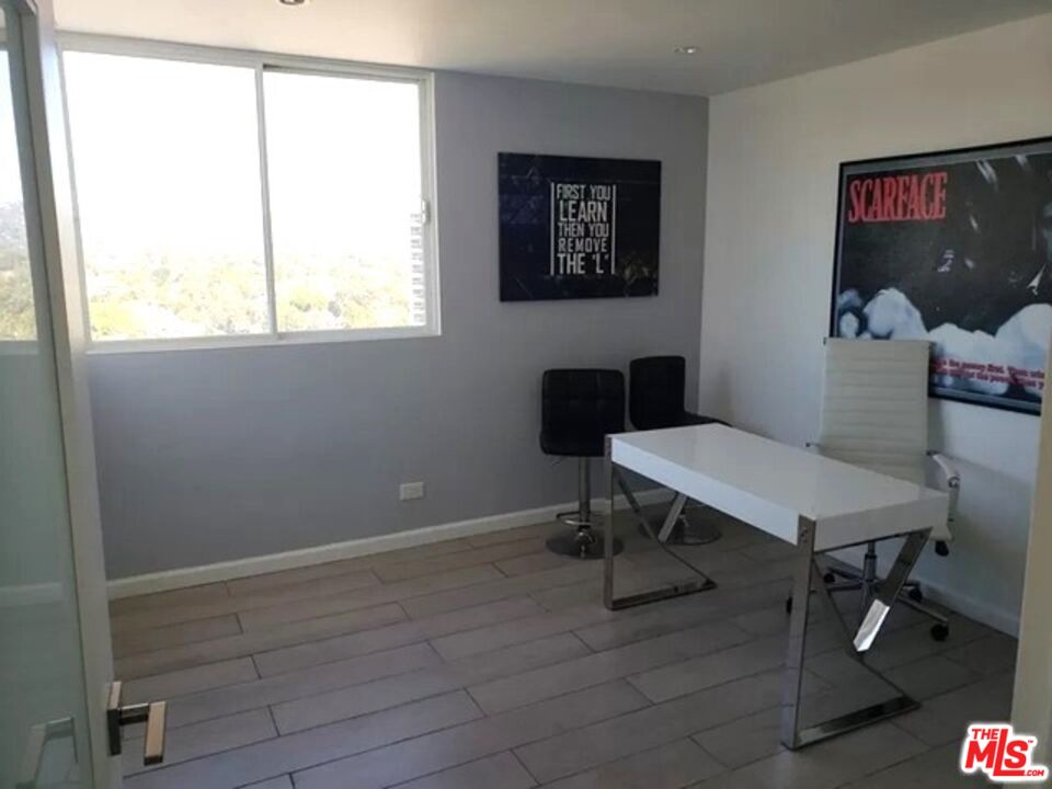 10501 Wilshire Boulevard, Unit 2103 Los Angeles, CA 90024 - Photo 12 of 19 a view of a workspace with furniture and a window