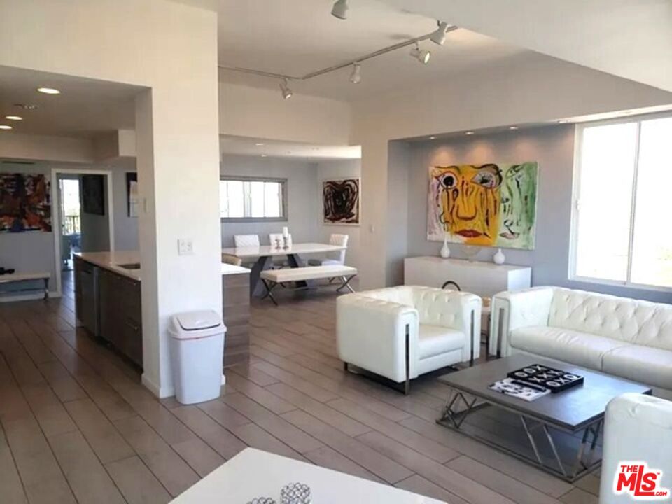 10501 Wilshire Boulevard, Unit 2103 Los Angeles, CA 90024 - Photo 3 of 19 a living room with furniture and a couch