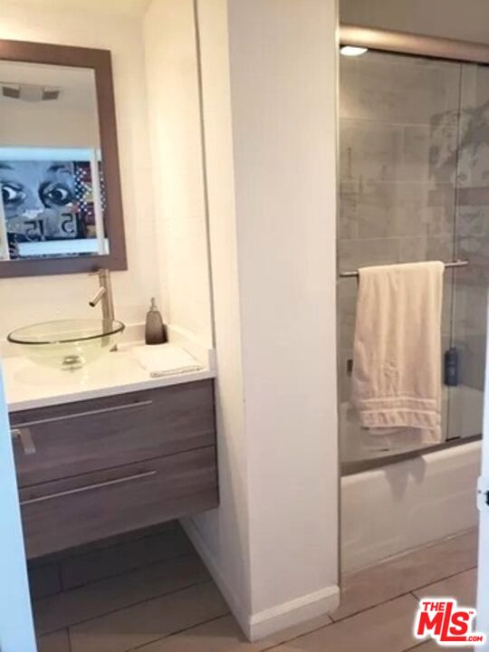 10501 Wilshire Boulevard, Unit 2103 Los Angeles, CA 90024 - Photo 10 of 19 a bathroom with a sink and a mirror