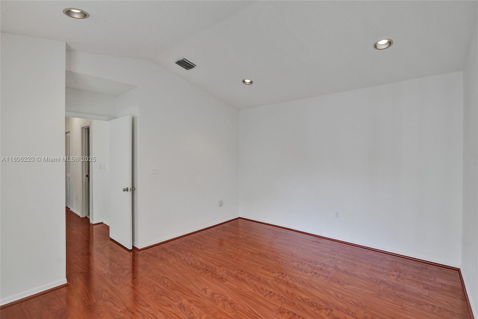 3910 Fern Forest Road Cooper City, FL 33026 - Photo 16 of 38 a view of an empty room with wooden floor