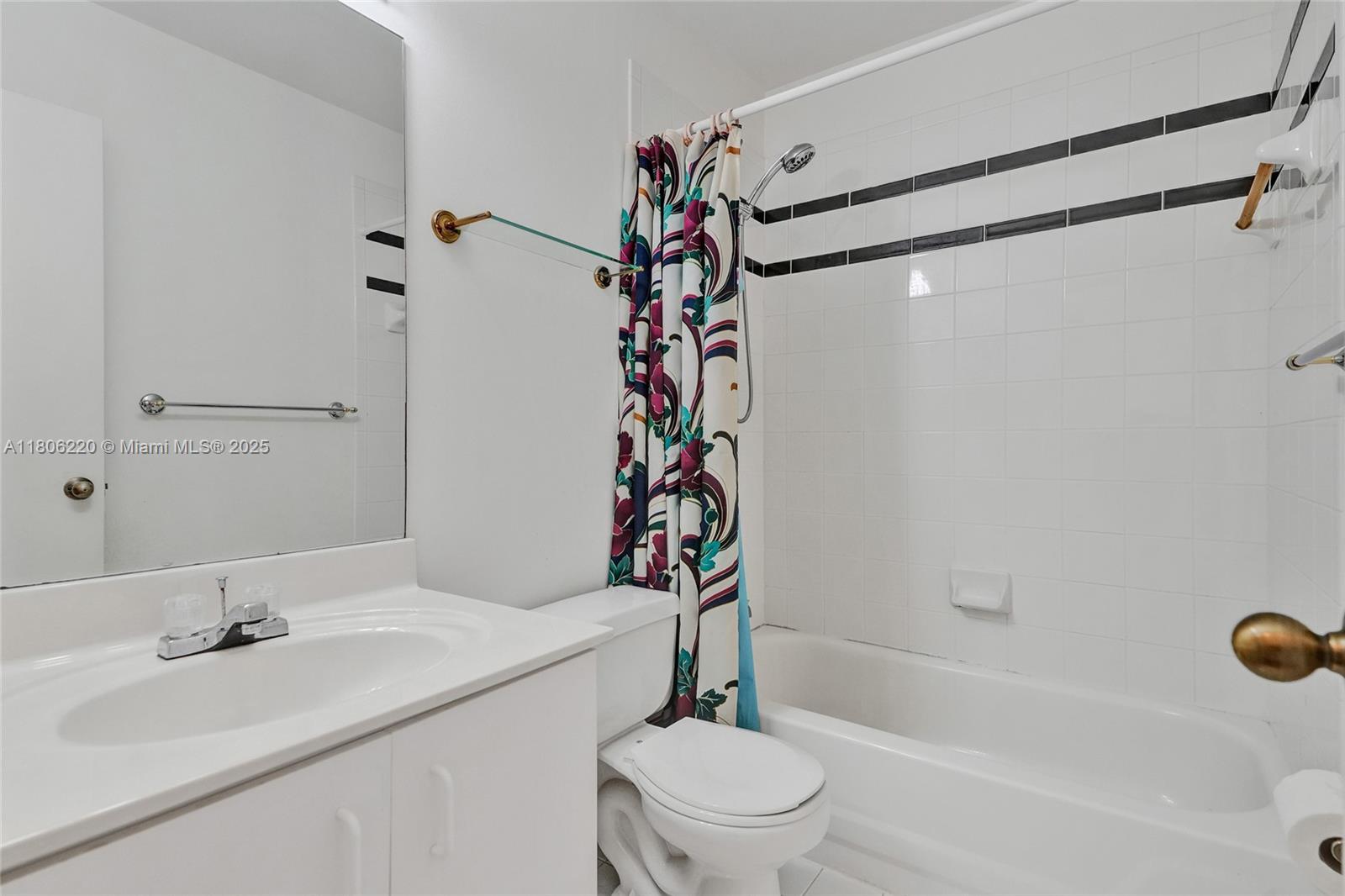 3910 Fern Forest Road Cooper City, FL 33026 - Photo 25 of 38 a bathroom with a sink a toilet and shower