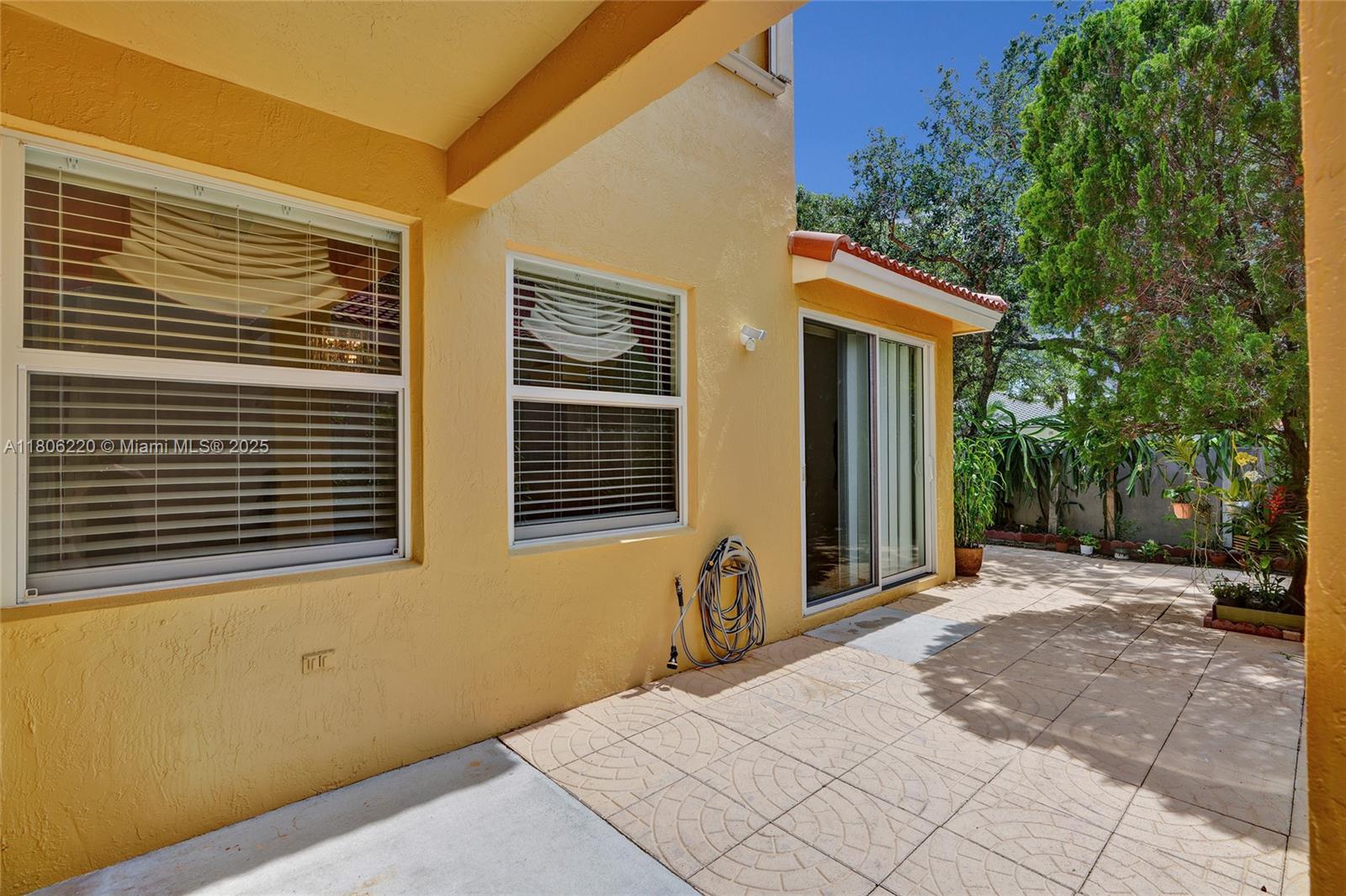 3910 Fern Forest Road Cooper City, FL 33026 - Photo 28 of 38 a view of a house with backyard and trees