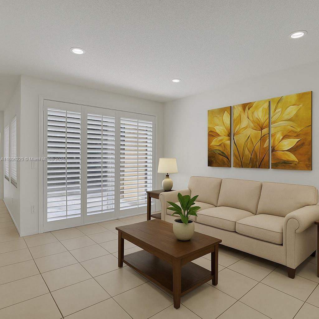 3910 Fern Forest Road Cooper City, FL 33026 - Photo 7 of 38 a living room with furniture and a large window