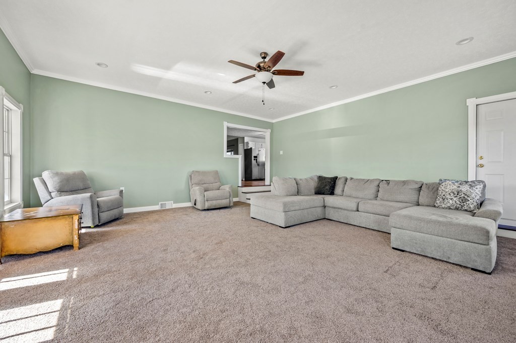 2040 Maples Branch Road Sevierville, TN 37876 - Photo 13 of 40 a living room with furniture and a ceiling fan