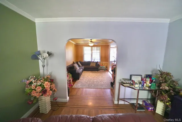 a living room with furniture and flowers