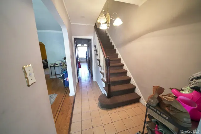 a view of entryway and hall with wooden floor