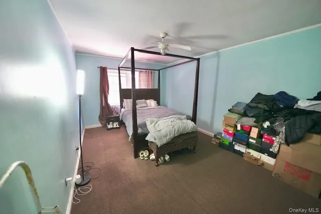 a bedroom with bed and a chandelier