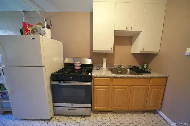 a kitchen with a stove and a refrigerator