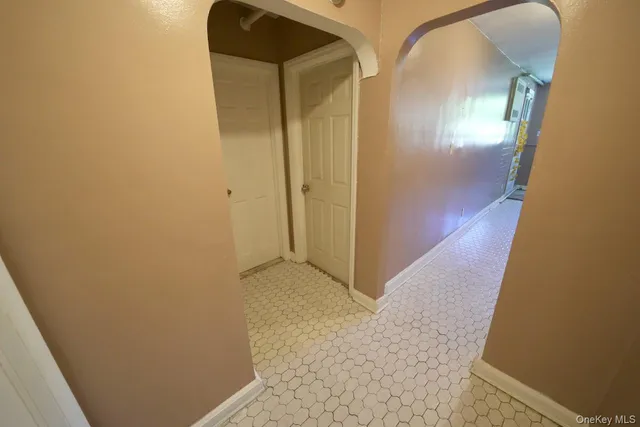 a living room with furniture and a gate