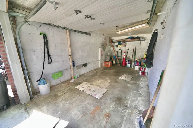 a view of a street with potted plants and large trees
