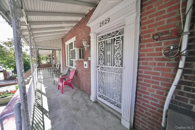 a view of an entryway with a bench