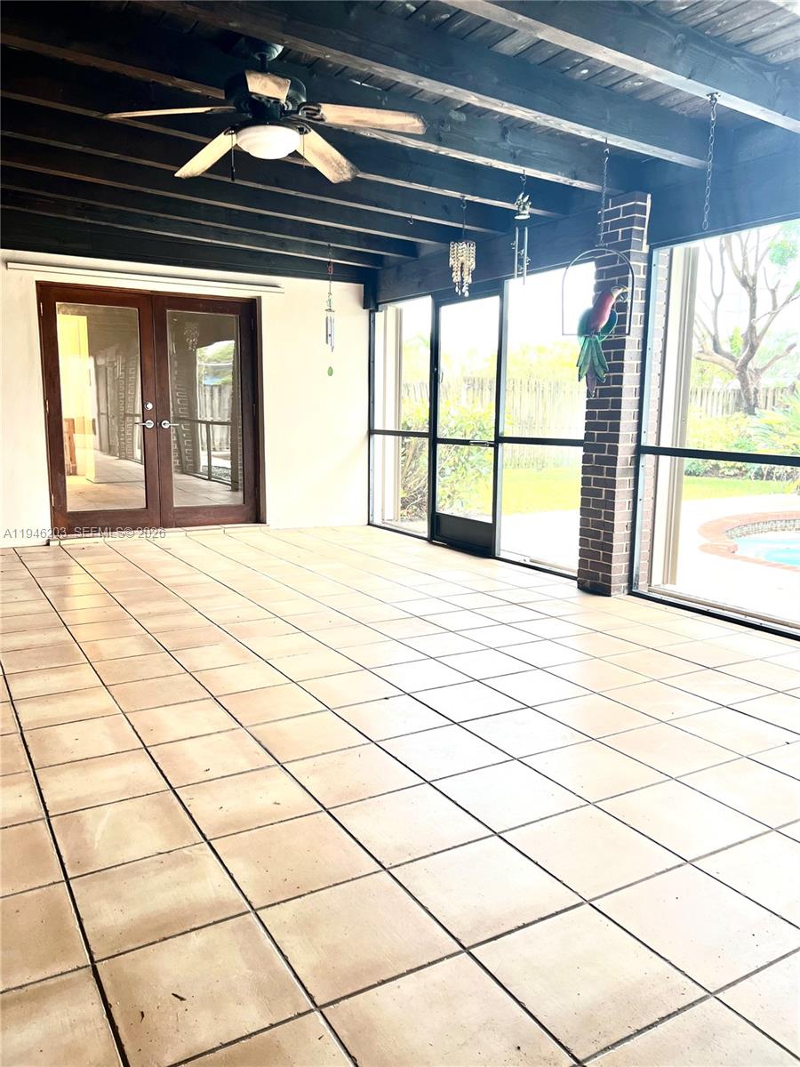 13100 Southwest 108th Place Miami, FL 33176 - Photo 14 of 16 a large room with a large window
