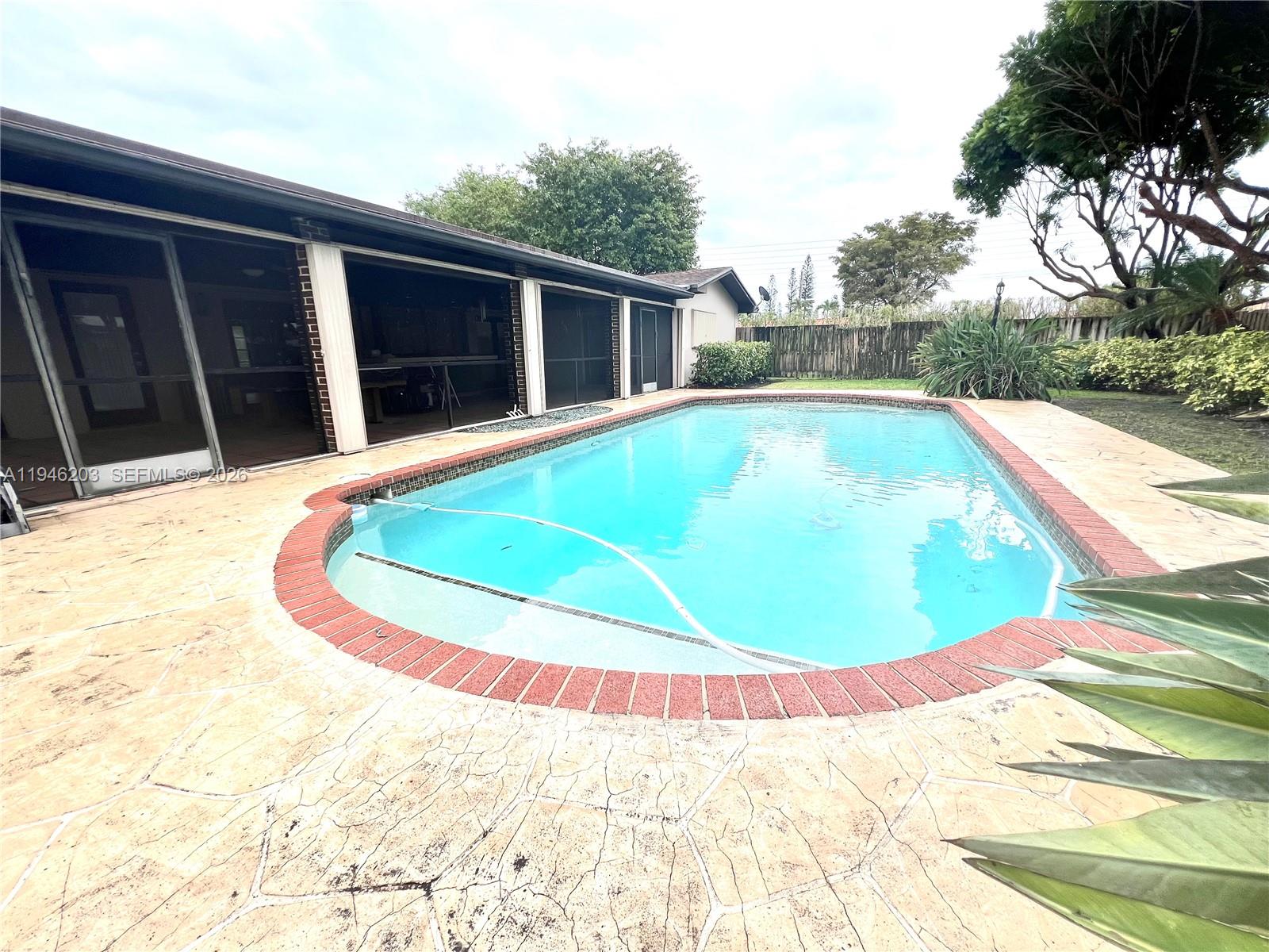 13100 Southwest 108th Place Miami, FL 33176 - Photo 15 of 16 a view of a swimming pool with yard