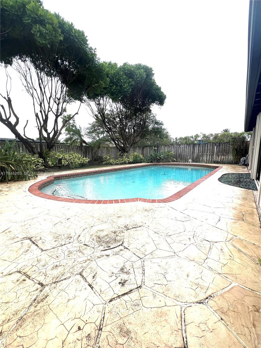 13100 Southwest 108th Place Miami, FL 33176 - Photo 16 of 16 a view of outdoor space and swimming pool