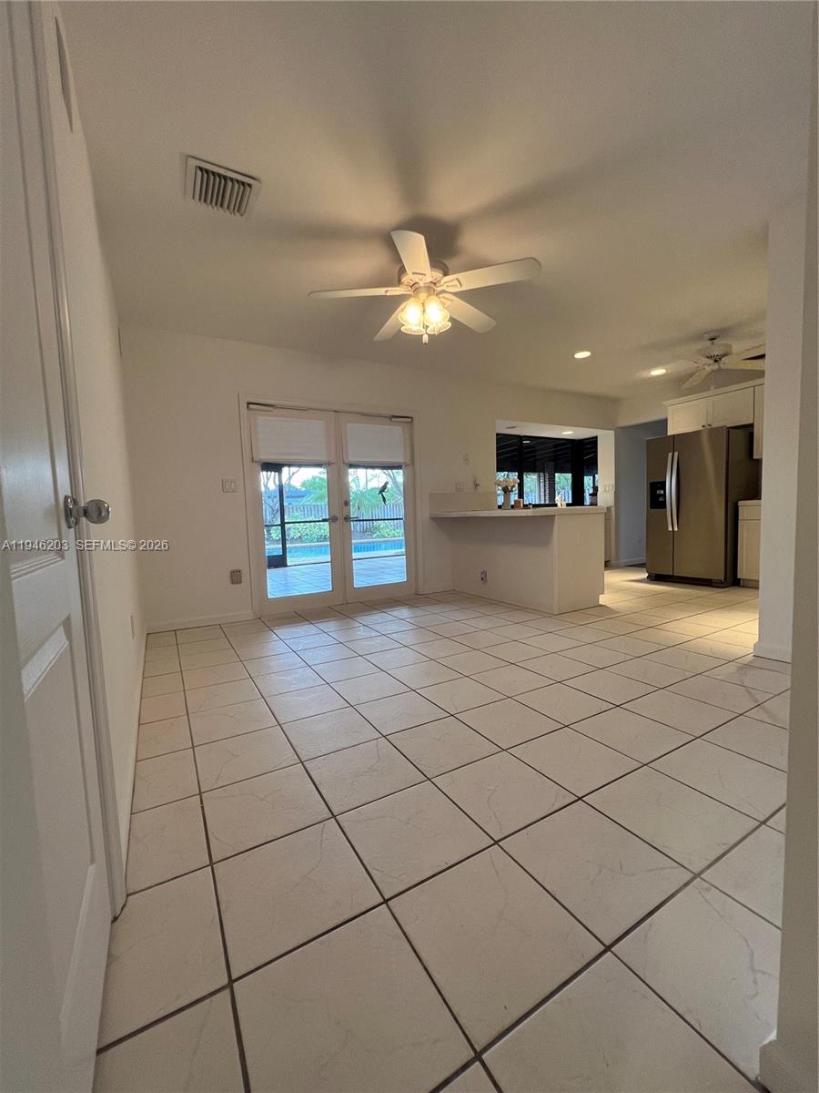 13100 Southwest 108th Place Miami, FL 33176 - Photo 7 of 16 a view of an empty room and window