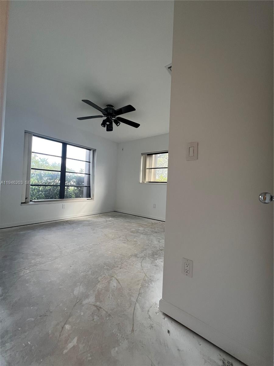 13100 Southwest 108th Place Miami, FL 33176 - Photo 9 of 16 a view of an empty room with a window