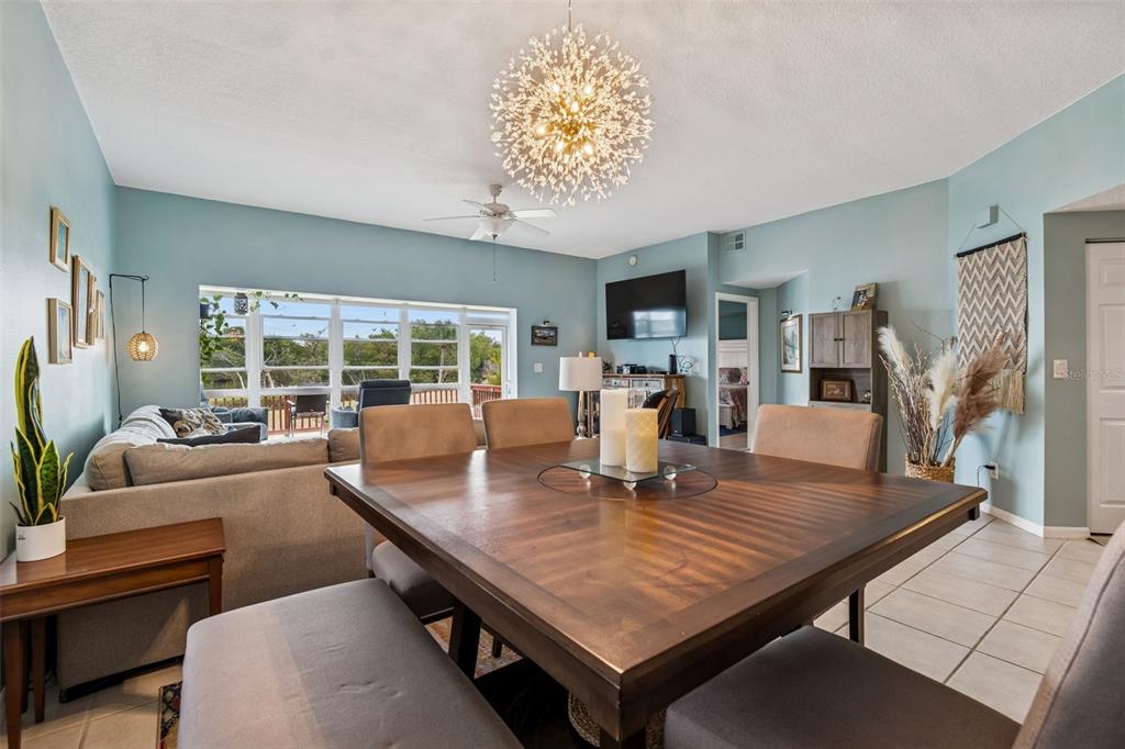 6499 99th Way North, Unit 18B St. Petersburg, FL 33708 - Photo 18 of 98 a view of a dining room with furniture window and outside view